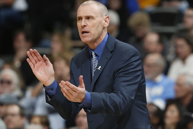 Dallas Mavericks coach Rick Carlisle applauds his team during the fourth quarter of an NBA basketball game against the Denver Nuggets on Wednesday, Jan. 14, 2015, in Denver. The Nuggets defeated the Mavericks 114-107. (AP Photo/David Zalubowski)
