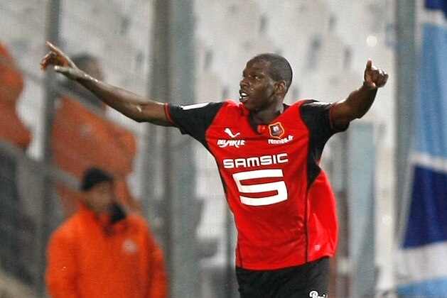 Rennes' Abdoulaye Doucoure celebrates after scoring against Marseille, during their League One soccer match, at the Velodrome Stadium, in Marseille, southern France, Saturday, March 22, 2014. (AP Photo/Claude Paris)