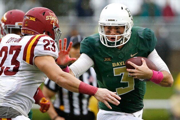 WACO, TX - OCTOBER 24: Jarrett Stidham #3 of the Baylor Bears runs against Darian Cotton #23 of the Iowa State Cyclones in the second half at McLane Stadium on October 24, 2015 in Waco, Texas. (Photo by Ron Jenkins/Getty Images)