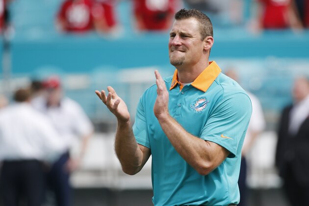 Miami Dolphins head coach Dan Campbell claps before an NFL football game against the Houston Texans, Sunday, Oct. 25, 2015 in Miami Gardens , Fla. (AP Photo/Wilfredo Lee)
