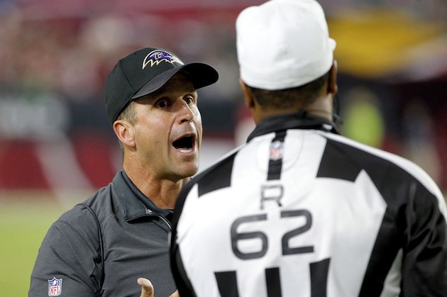 Baltimore Ravens head coach John Harbaugh yells to referee Ronald Torbert (62) during the second half of an NFL football game against the Arizona Cardinals, Monday, Oct. 26, 2015, in Glendale, Ariz. (AP Photo/Ross D. Franklin)