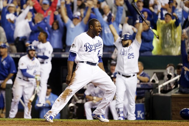 Kansas City Royals' Lorenzo Cain celebrates  after scoring on a hit by Eric Hosmer against the Toronto Blue Jays during the eight inning in Game 6 of baseball's American League Championship Series on Friday, Oct. 23, 2015, in Kansas City, Mo. (AP Photo/Matt Slocum)