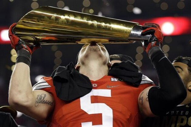 Ohio State's Jeff Heuerman holds the championship trophy after the NCAA college football playoff championship game against Oregon Monday, Jan. 12, 2015, in Arlington, Texas. Ohio State won 42-20. (AP Photo/David J. Phillip)