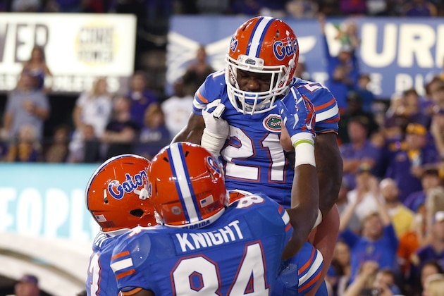 Florida running back Kelvin Taylor (21) celebrates his touchdown with tight end Camrin Knight (84) in the second half of an NCAA college football game against LSU in Baton Rouge, La., Saturday, Oct. 17, 2015. LSU won 35-28. (AP Photo/Gerald Herbert)