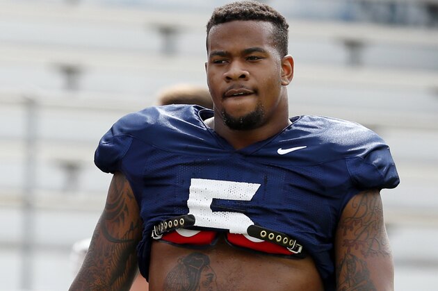 In this Aug. 9, 2014, photo, Mississippi defensive player Robert Nkemdiche takes a pause during the team's final open NCAA college football practice, in Oxford Miss. Nkemdiche was the consensus No. 1 recruit in the country in 2013, and the defensive lineman arrived at Mississippi with lofty aspirations of dominating the Southeastern Conference. Then, as the transition to high-level college football often does to young players, Nkemdiche was humbled, struggling to learn a new position while also trying to get a handle on the playbook. Then came a hamstring injury. For many highly recruited SEC players, early hype can lead to unrealistic expectations. Now, Nkemdiche is part of group of young but experienced players around the league hoping to have breakout seasons. (AP Photo/Rogelio V. Solis)