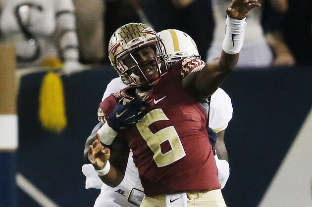 Georgia Tech defensive lineman Antonio Simmons (93) tries to tackle Florida State quarterback Everett Golson (6) during the first half of an NCAA college football game, Saturday, Oct. 24, 2015, in Atlanta. (AP Photo/Mike Stewart)