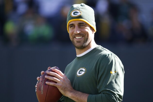 Green Bay Packers quarterback Aaron Rodgers warms up before the start of an NFL football game between the Green Bay Packers and the San Diego Chargers, Sunday, Oct. 18, 2015, in Green Bay, Wis. (AP Photo/Mike Roemer)