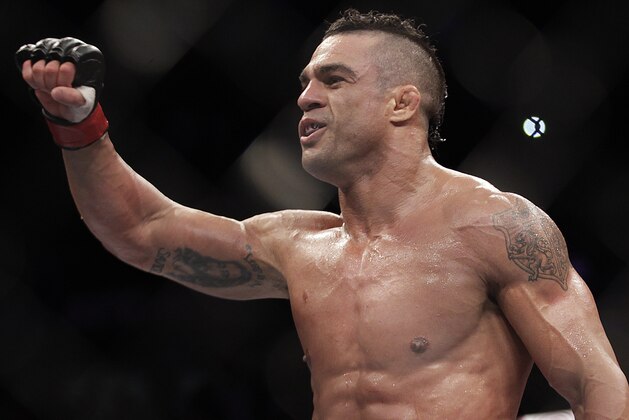 Vitor Belfort, from Brazil, celebrates after defeating Michael Bisping, from Britain during their  middleweight mixed martial arts bout at the Ultimate Fighting Championship (UFC) in Sao Paulo, Brazil, Sunday, Jan. 20, 2013. (AP Photo/Andre Penner)