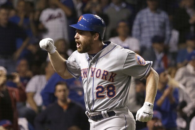 New York Mets' Daniel Murphy celebrates after hitting a two-run home run during the eighth inning of Game 4 of the National League baseball championship series against the Chicago Cubs Wednesday, Oct. 21, 2015, in Chicago. (AP Photo/David J. Phillip)