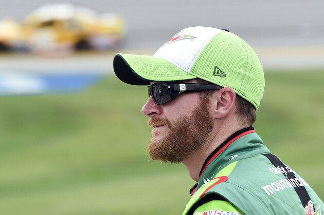 Sprint Cup Series driver Dale Earnhardt Jr. (88) watches qualifying for the  NASCAR Sprint Cup Series auto race at Talladega Superspeedway Saturday, Oct. 24, 2015, in Talladega, Ala. (AP Photo/ Mark Almond )