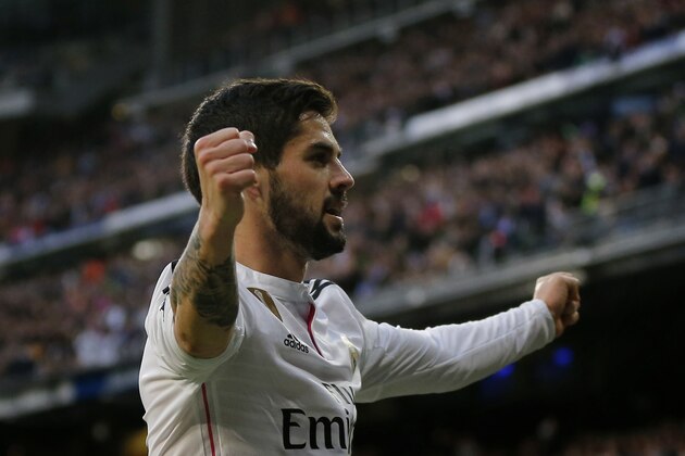 Real Madrid’s Isco celebrates after scoring a goal during a Spanish La Liga soccer match between Real Madrid and Deportivo La Coruna at the Santiago Bernabeu stadium in Madrid, Spain, Saturday, Feb. 14, 2015. (AP Photo/Daniel Ochoa de Olza)