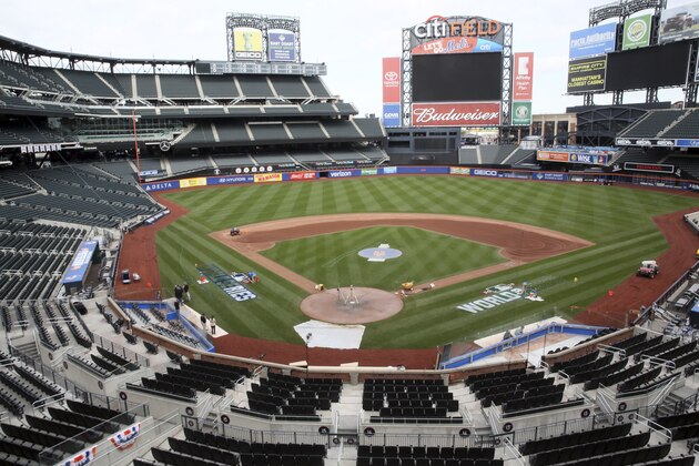 Grounds crew prepare Citi Field for of the Major League Baseball World Series between the New York Mets and the Kansas City Royals, Tuesday, Oct. 27, 2015, in New York. Game 1 of the World Series is Tuesday in Kansas City. (AP Photo/Mary Altaffer)