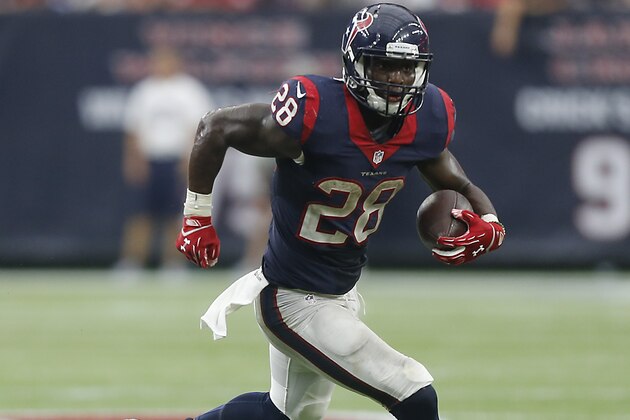 HOUSTON, TX - SEPTEMBER 27:  Alfred Blue #28 of the Houston Texans runs with the ball aTampa Bay Buccaneers at NRG Stadium on September 27, 2015 in Houston, Texas.  (Photo by Bob Levey/Getty Images)