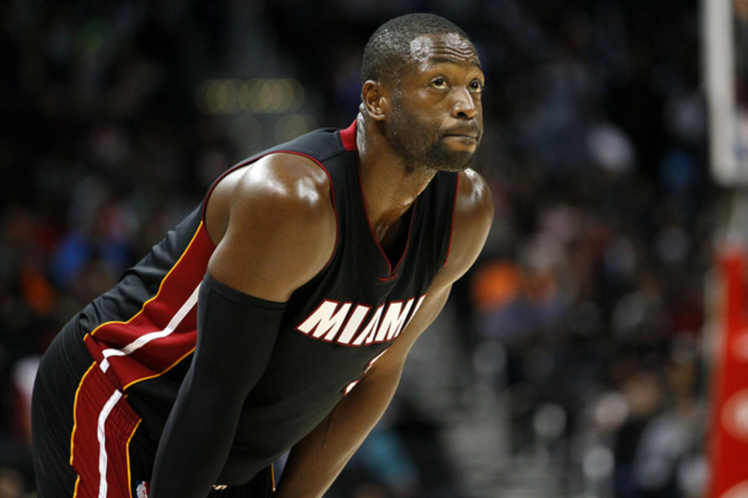 Miami Heat guard Dwyane Wade (3)  looks up during the first half of a preseason NBA basketball game against the Atlanta Hawks on Sunday, Oct. 18, 2015, in Atlanta. The Heat won the game 101-92. (AP Photo/Todd Kirkland)
