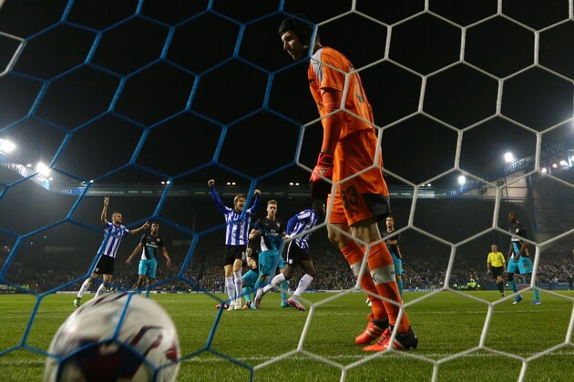 SHEFFIELD, ENGLAND - OCTOBER 27:  Lucas Joao (C) of Sheffield Wednesday celebrates after scoring his team's second goal as the dejected Petr Cech of Arsenal looks on during the Capital One Cup fourth round match between Sheffield Wednesday and Arsenal at Hillsborough Stadium on October 27, 2015 in Sheffield, England.  (Photo by Matthew Lewis/Getty Images)