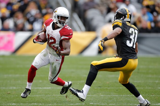 PITTSBURGH, PA - OCTOBER 18:  John Brown #12 of the Arizona Cardinals carries the ball in front of Ross Cockrell #31 of the Pittsburgh Steelers at Heinz Field on October 18, 2015 in Pittsburgh, Pennsylvania.  (Photo by Gregory Shamus/Getty Images)
