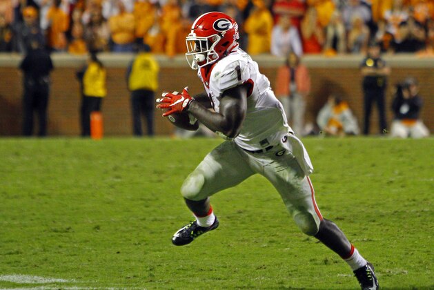 Georgia running back Sony Michel (1) runs for yardage during the second half of an NCAA college football game against Tennessee Saturday, Oct. 10, 2015, in Knoxville, Tenn. Tennessee won 38-31. (AP Photo/Wade Payne)