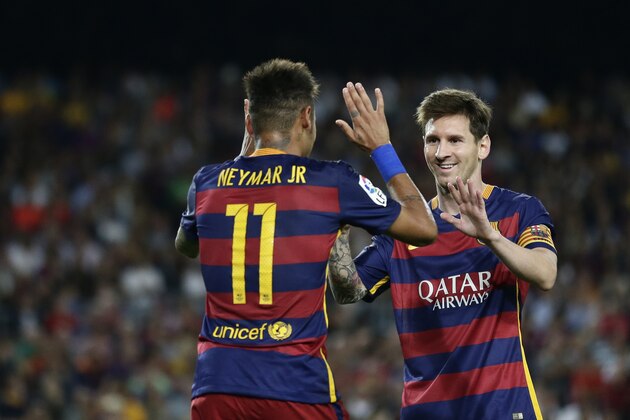 FC Barcelona's Lionel Messi, left, celebrates after scoring with teammate Neymar during a Spanish La Liga soccer match against Levante at the Camp Nou stadium in Barcelona, Spain, Sunday, Sept. 20, 2015. (AP Photo/Manu Fernandez)