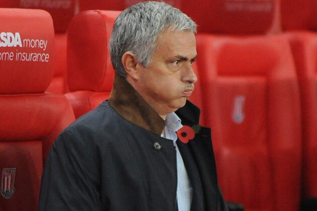 Chelsea manager Jose Mourinho in the dug out before the English League Cup Fourth Round soccer match between Stoke City and Chelsea at the Britannia Stadium, Stoke on Trent, England, Tuesday, Oct. 27, 2015. (AP Photo/Rui Vieira)