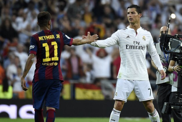 Barcelona's Brazilian forward Neymar da Silva Santos Junior (L) congratulates Real Madrid's Portuguese forward Cristiano Ronaldo on winning after the Spanish league 'Clasico' football match Real Madrid CF vs FC Barcelona at the Santiago Bernabeu stadium in Madrid on October 25, 2014. Real Madrid won the match 3-1.  AFP PHOTO / GERARD JULIEN        (Photo credit should read GERARD JULIEN/AFP/Getty Images)