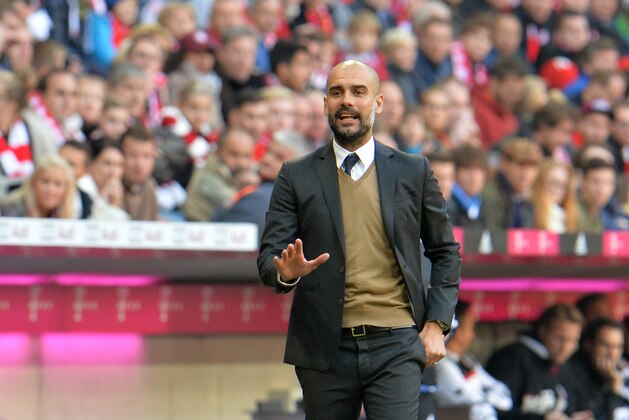 Munich head coach Pep Guardiola   gestures during the German Bundesliga soccer match between FC Bayern Munich and FC Cologne in the Allianz Arena in Munich, Germany, on Saturday, Oct. 24, 2015. (AP Photo/Kerstin Joensson)