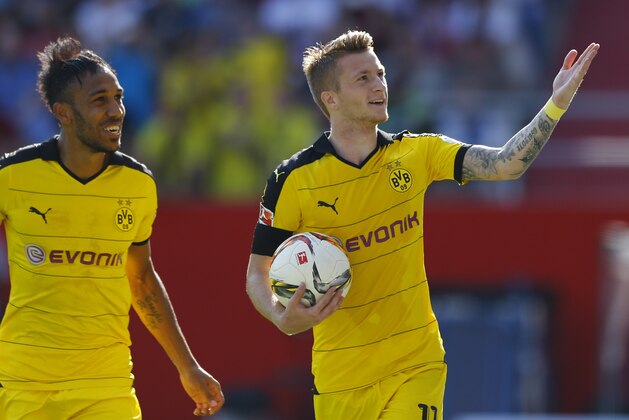 Dortmund's Marco Reus, right, and teammate Pierre-Emerick Aubameyang  celebrate after Reus scored their side's second goal during the German Bundesliga soccer match between FC Ingolstadt 04 and Borussia Dortmund in Ingolstadt, Germany, Sunday, Aug. 23, 2015. (AP Photo/Matthias Schrader)