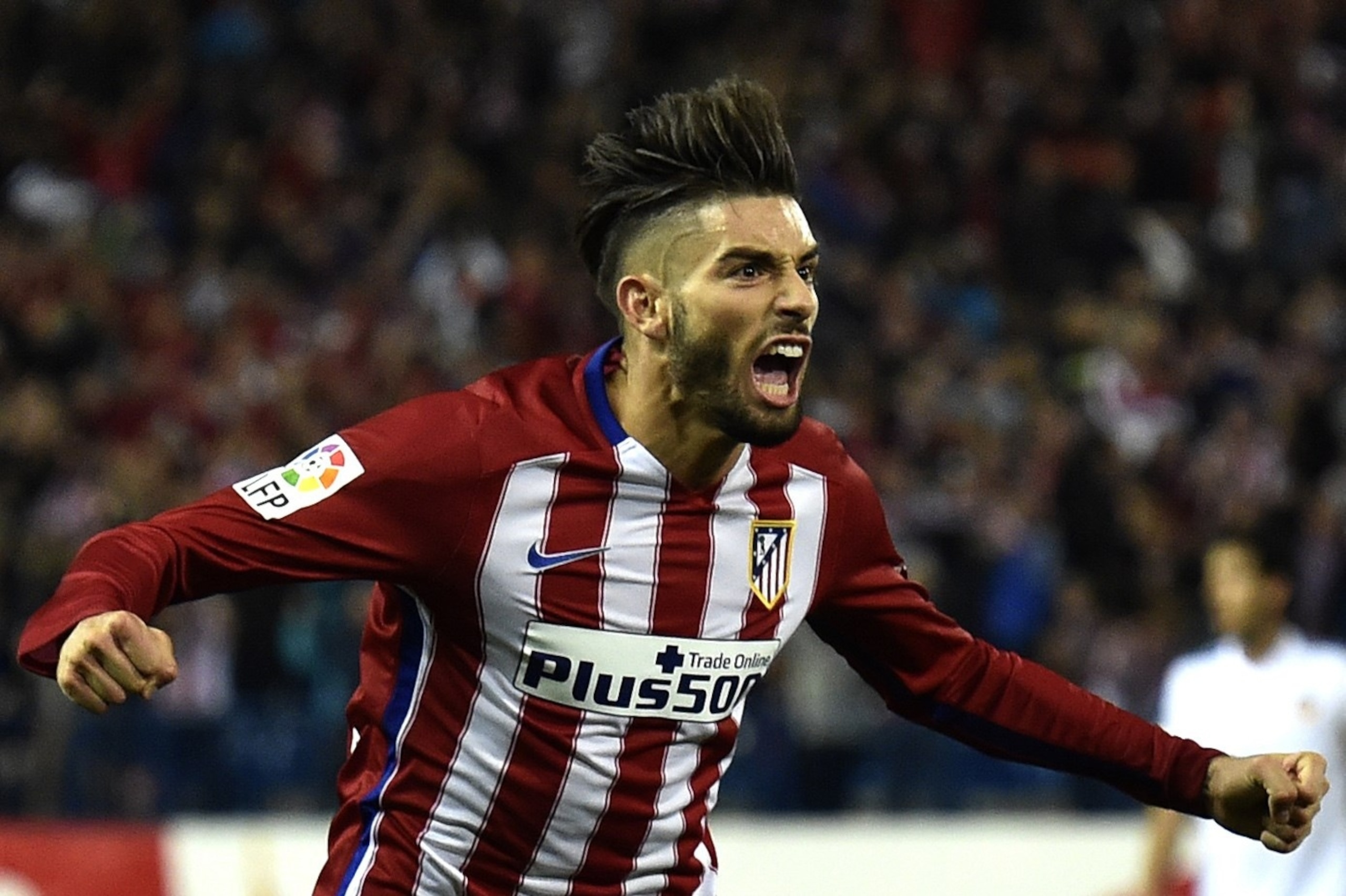 Atletico Madrid's Belgian midfielder Yannick Ferreira Carrasco celebrates a goal during the Spanish league football match Club Atletico de Madrid vs Valencia CF at the Vicente Calderon stadium in Madrid on October 25, 2015. AFP PHOTO/ GERARD JULIEN (Photo credit should read GERARD JULIEN/AFP/Getty Images) Atletico Madrid's Belgian midfielder Yannick Ferreira Carrasco celebrates a goal during the Spanish league football match Club Atletico de Madrid vs Valencia CF at the Vicente Calderon stadium in Madrid on October 25, 2015. AFP PHOTO/ GERARD JULIEN (Photo credit should read GERARD JULIEN/AFP/Getty Images)