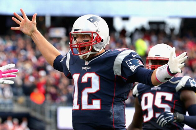 FOXBORO, MA - OCTOBER 25:  Tom Brady #12 of the New England Patriots reacts after throwing a touchdown pass during the fourth quarter against the New York Jets at Gillette Stadium on October 25, 2015 in Foxboro, Massachusetts.  (Photo by Jim Rogash/Getty Images)