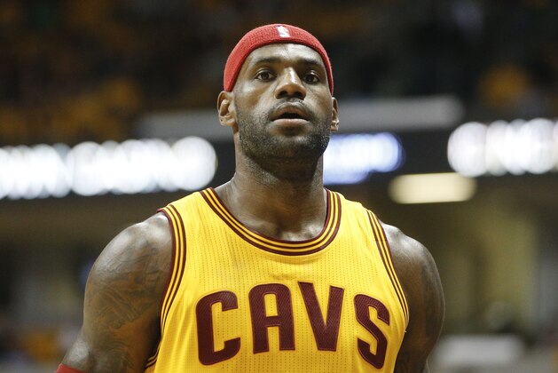 Cleveland Cavaliers forward LeBron James (23) walks to the bench in the first half of an NBA preseason basketball game against the Atlanta Hawks, Wednesday, Oct. 7, 2015, in Cincinnati. The Hawks won 98-96. (AP Photo/John Minchillo)