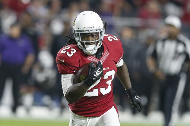 Arizona Cardinals running back Chris Johnson (23) runs for a touchdown against the Baltimore Ravens during the first half of an NFL football game, Monday, Oct. 26, 2015, in Glendale, Ariz. (AP Photo/Rick Scuteri)