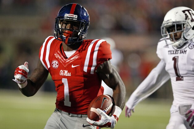 Mississippi wide receiver Laquon Treadwell (1) sprints away from Texas A&M defensive back De'Vante Harris (1) for a 58 yard touchdown pass reception during the second half of their NCAA college football game in Oxford, Miss., Saturday, Oct. 24, 2015. No. 24 Mississippi won 23-3. (AP Photo/Rogelio V. Solis)