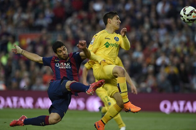 Barcelona's Uruguayan forward Luis Suarez scores a goal during the Spanish league football match FC Barcelona vs Getafe at the Camp Nou stadium in Barcelona on April 28, 2015.   AFP PHOTO/ LLUIS GENE        (Photo credit should read LLUIS GENE/AFP/Getty Images)