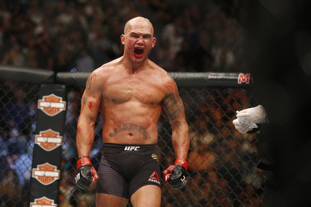 Robbie Lawler celebrates after defeating Rory MacDonald in their welterweight title mixed martial arts bout at UFC 189 on Saturday, July 11, 2015, in Las Vegas. (AP Photo/John Locher)