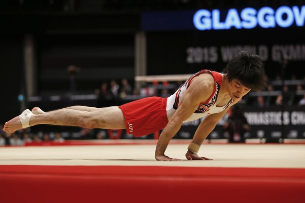 Japan’s Kohei Uchimura performs during the floor exercise in the men's team final competition at the World Artistic Gymnastics championships at the SSE Hydro Arena in Glasgow, Scotland, Wednesday, Oct. 28, 2015. (AP Photo/Matthias Schrader)