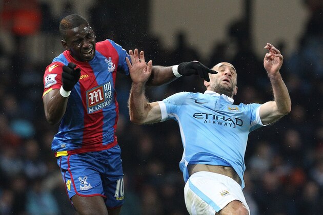 Manchester City's Argentinian defender Pablo Zabaleta (R) vies with Crystal Palace's French-born Congolese midfielder Yannick Bolasie during the English League Cup fourth round football match between Manchester City and Crystal Palace at The Etihad Stadium in Manchester, north west England on October 28, 2015. AFP PHOTO / LINDSEY PARNABY

RESTRICTED TO EDITORIAL USE. NO USE WITH UNAUTHORIZED AUDIO, VIDEO, DATA, FIXTURE LISTS, CLUB/LEAGUE LOGOS OR 'LIVE' SERVICES. ONLINE IN-MATCH USE LIMITED TO 75 IMAGES, NO VIDEO EMULATION. NO USE IN BETTING, GAMES OR SINGLE CLUB/LEAGUE/PLAYER PUBLICATIONS.        (Photo credit should read LINDSEY PARNABY/AFP/Getty Images)