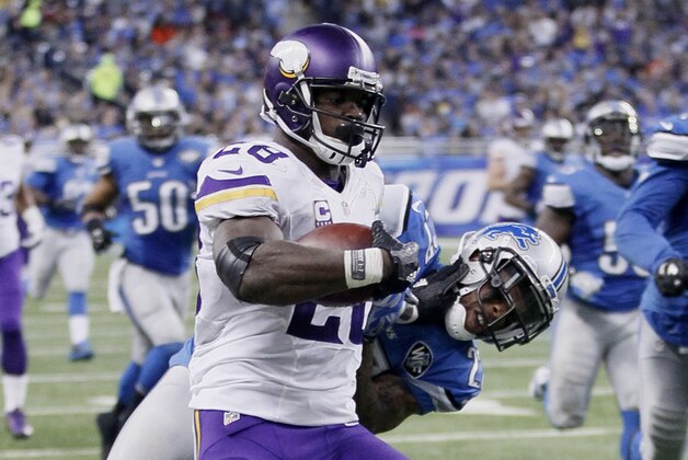 Minnesota Vikings running back Adrian Peterson (28) is dragged down on his 75-yard run by Detroit Lions free safety Glover Quin (27) during the second half of an NFL football game against the Detroit Lions, Sunday, Oct. 25, 2015, in Detroit. (AP Photo/Duane Burleson)