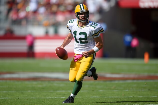 SANTA CLARA, CA - OCTOBER 04:  Aaron Rodgers #12 of the Green Bay Packers runs with the ball against the San Francisco 49ers during the third quarter at Levi's Stadium on October 4, 2015 in Santa Clara, California.  (Photo by Thearon W. Henderson/Getty Images)