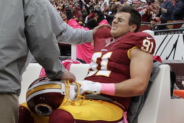 Washington Redskins outside linebacker Ryan Kerrigan (91) sits on the bench after an injury during the first half of an NFL football game against the Philadelphia Eagles in Landover, Md., Sunday, Oct. 4, 2015. (AP Photo/Mark Tenally)