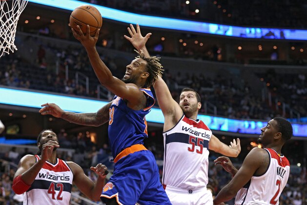 WASHINGTON, DC - OCTOBER 09: Derrick Williams #23 of the New York Knicks puts up a shot in front of Josh Harrellson #55 of the Washington Wizards during the first half at Verizon Center on October 9, 2015 in Washington, DC. NOTE TO USER: User expressly acknowledges and agrees that, by downloading and or using this photograph, User is consenting to the terms and conditions of the Getty Images License Agreement. (Photo by Patrick Smith/Getty Images)