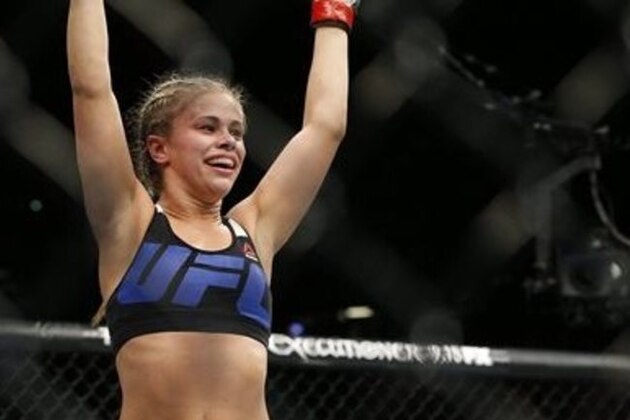 Paige VanZant celebrates after defeating Alex Chambers in their women’s straw weight mixed martial arts bout at UFC 191 on Saturday, Sept. 5, 2015, in Las Vegas. (AP Photo/John Locher)