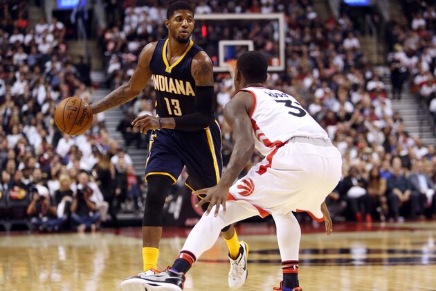 TORONTO, ON - OCTOBER 28:  Paul George #13 of the Indiana Pacers dribbles past Terrance Ross #31 of the Toronto Raptors during the NBA season opener at Air Canada Centre on October 28, 2015 in Toronto, Ontario, Canada.  NOTE TO USER: User expressly acknowledges and agrees that, by downloading and or using this photograph, User is consenting to the terms and conditions of the Getty Images License Agreement.  (Photo by Vaughn Ridley/Getty Images)