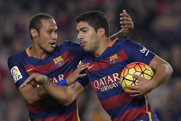Barcelona's Brazilian forward Neymar (L) celebrates Barcelona's Uruguayan forward Luis Suarez's goal during the Spanish league football match FC Barcelona vs SD Eibar at the Camp Nou stadium in Barcelona on October 25, 2015.   AFP PHOTO/ LLUIS GENE        (Photo credit should read LLUIS GENE/AFP/Getty Images)