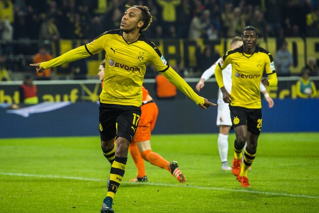 Dortmund's Gabonese midfielder Pierre-Emerick Aubameyang celebrates scoring his side's 5th goal to complete his hat-trick during the German first division football Bundesliga match between Borussia Dortmund and FC Augsburg on October 25, 2015 in Dortmund, western Germany. Dortmund won the match 5-1. AFP PHOTO / ODD ANDERSEN
RESTRICTIONS: DURING MATCH TIME: DFL RULES TO LIMIT THE ONLINE USAGE TO 15 PICTURES PER MATCH AND FORBID IMAGE SEQUENCES TO SIMULATE VIDEO. 
==RESTRICTED TO EDITORIAL USE ==
FOR FURTHER QUERIES PLEASE CONTACT THE DFL DIRECTLY AT + 49 69 650050.        (Photo credit should read ODD ANDERSEN/AFP/Getty Images)