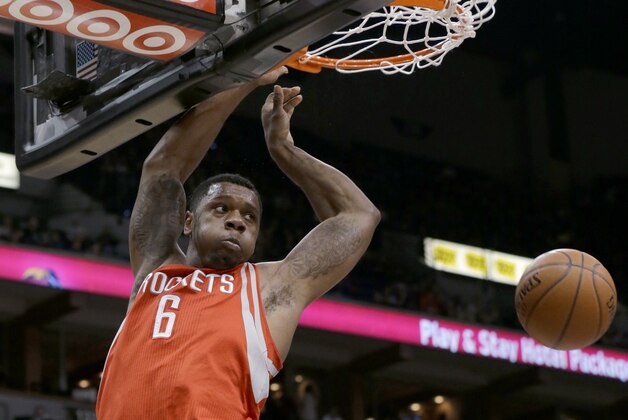 Houston Rockets forward Terrence Jones dunks during the first quarter of an NBA basketball game against the Minnesota Timberwolves in Minneapolis, Friday, April 11, 2014. (AP Photo/Ann Heisenfelt)