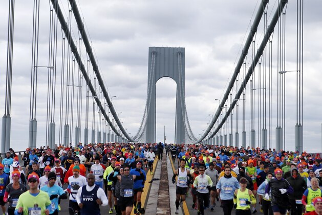 Runners cross the Verrazano-Narrows Bridge at the start of the New York City Marathon, Sunday, Nov. 2, 2014, in New York. (AP Photo/Jason DeCrow)