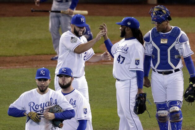 Members of the Kansas City Royals celebrates their 7-1 win against the New York Mets in Game 2 of the Major League Baseball World Series Wednesday, Oct. 28, 2015, in Kansas City, Mo. (AP Photo/Charlie Riedel)
