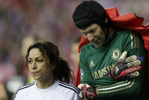 FILE - This is a Tuesday, April 22, 2014 file photo of Chelsea team doctor Eva Carneiro  as she walks with Chelsea goalkeeper Petr Cech who holds his arm  as he leaves the pitch  following an injury during the Champions League semifinal first leg soccer match between Atletico Madrid and Chelsea at the Vicente Calderon stadium in Madrid, Spain. The Football Medical Association said Wednesday Sept. 23, 2015 that it is