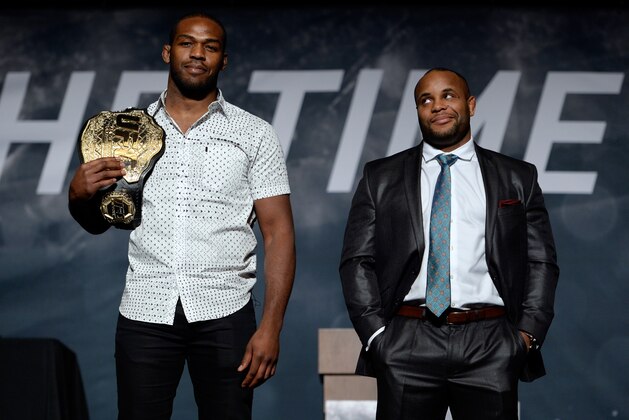 LAS VEGAS, NEVADA - NOVEMBER 17:  UFC light heavyweight champion Jon Jones (L) and challenger Daniel Cormier pose for the media during the UFC Time Is Now press conference at The Smith Center for the Performing Arts on November 17, 2014 in Las Vegas, Nevada. (Photo by Jeff Bottari/Zuffa LLC/Zuffa LLC via Getty Images)
