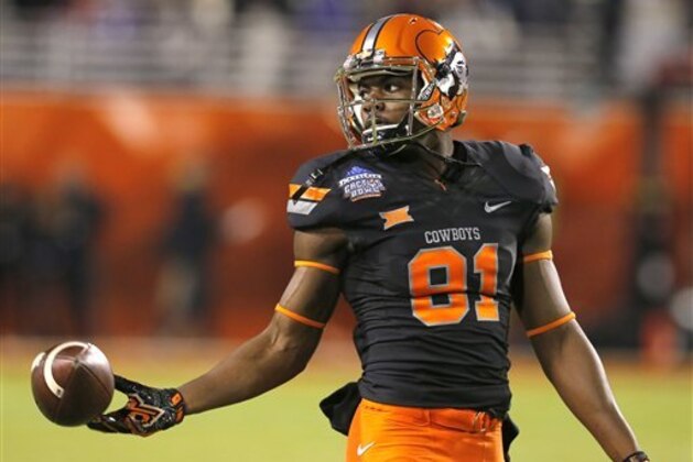 Oklahoma State wide receiver Jhajuan Seales (81) in the first half during the Cactus Bowl NCAA college football game against Washington, Friday, Jan. 2, 2015, in Tempe, Ariz. (AP Photo/Rick Scuteri)