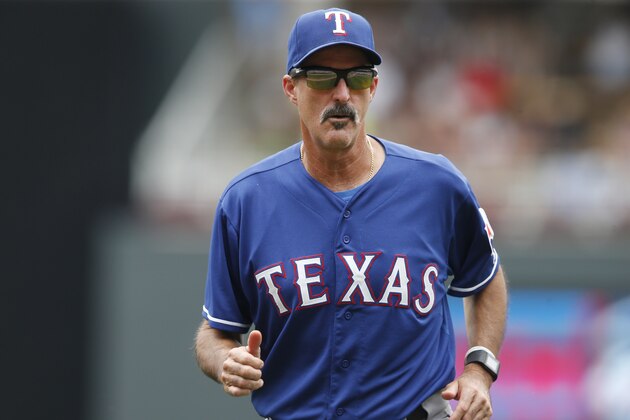 Texas Rangers pitching coach Mike Maddux returns to the dugout in a baseball game against the Minnesota Twins, Thursday, Aug. 13, 2015, in Minneapolis. (AP Photo/Jim Mone)